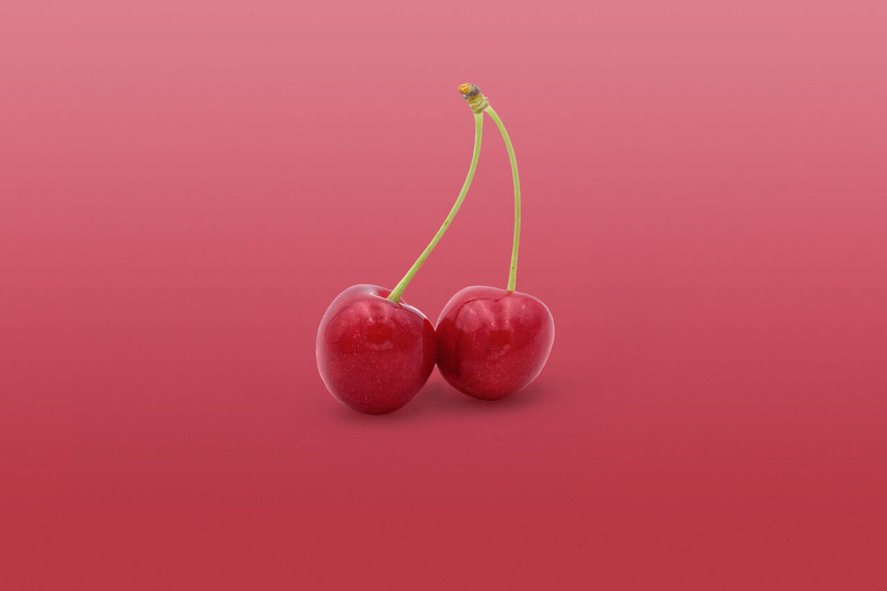 Cherries on purple background